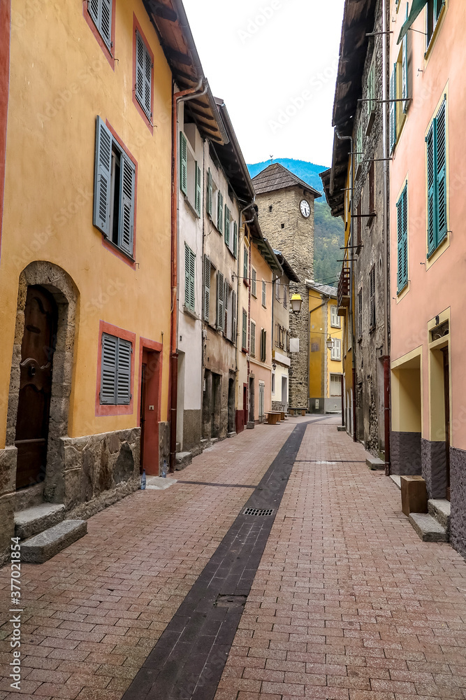 Alley between old houses in the small and charming commune of Isola, Provence-Alpes-Côte d'Azur region, Alpes-Maritimes, France