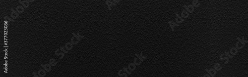 Panorama of Rough patterned black cement wall texture and seamless background