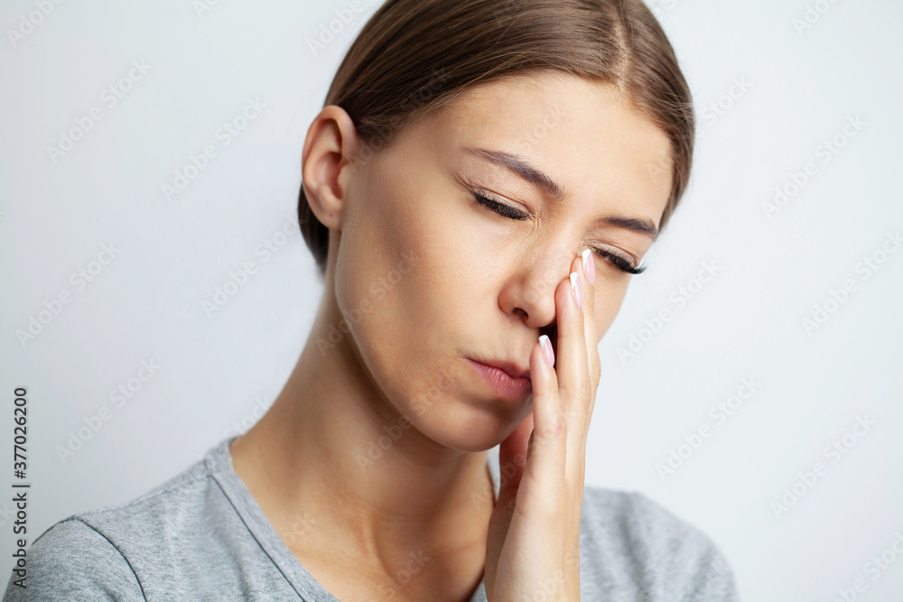 Close up of a beautiful young woman experiencing a painful toothache Close up of a beautiful young woman experiencing a painful toothache