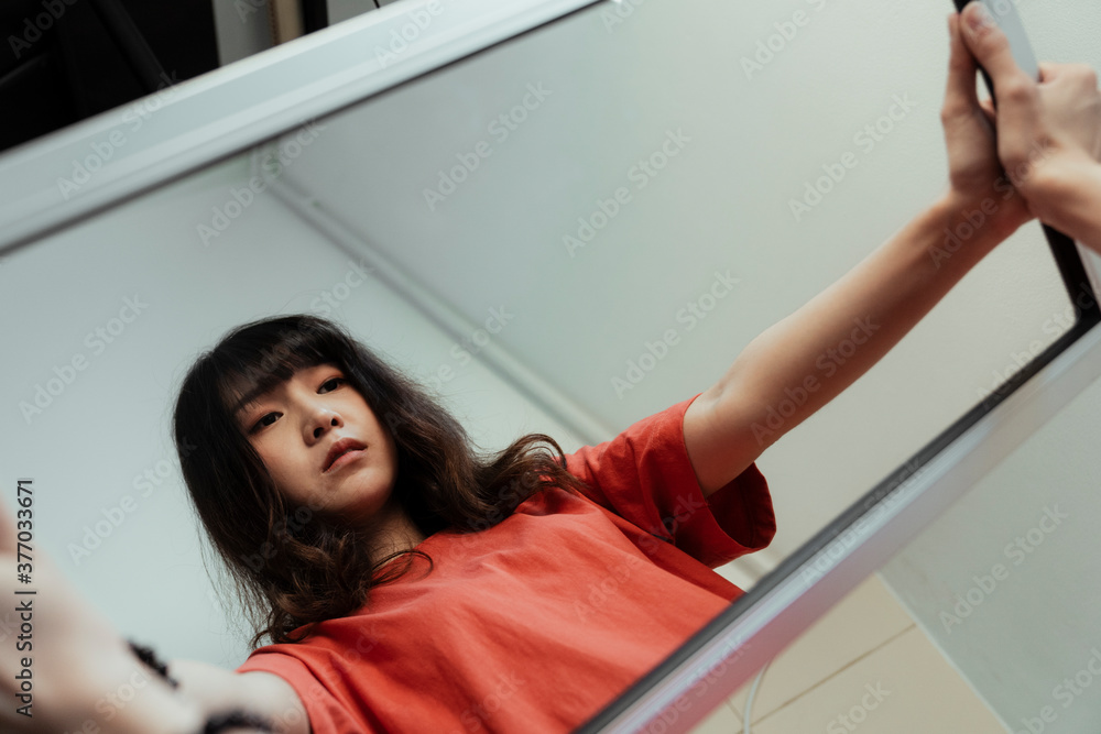 Woman hold the mirror with her hands but her reflection shows her empty eyesight. Woman hold the mirror with her hands but her reflection shows her empty eyesight.