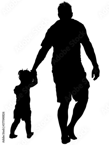 手をつなぐ父子のシルエット