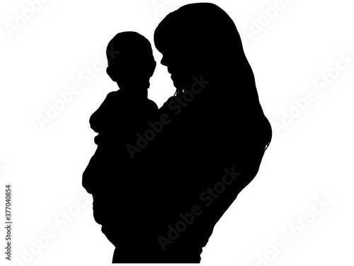 子供を抱っこする母親のシルエット