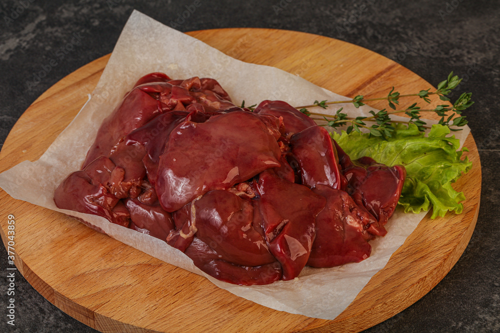 Raw chicken liver over board