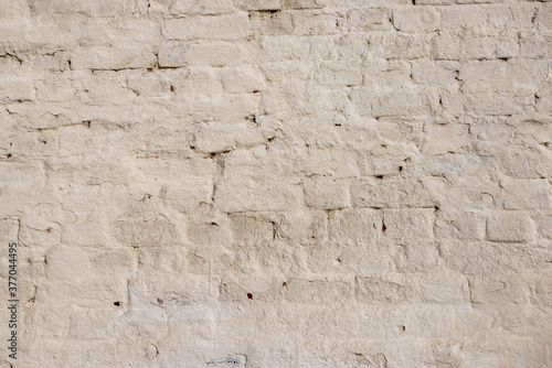 Obraz na płótnie The texture of the old brick wall painted white with peeling paint w salonie