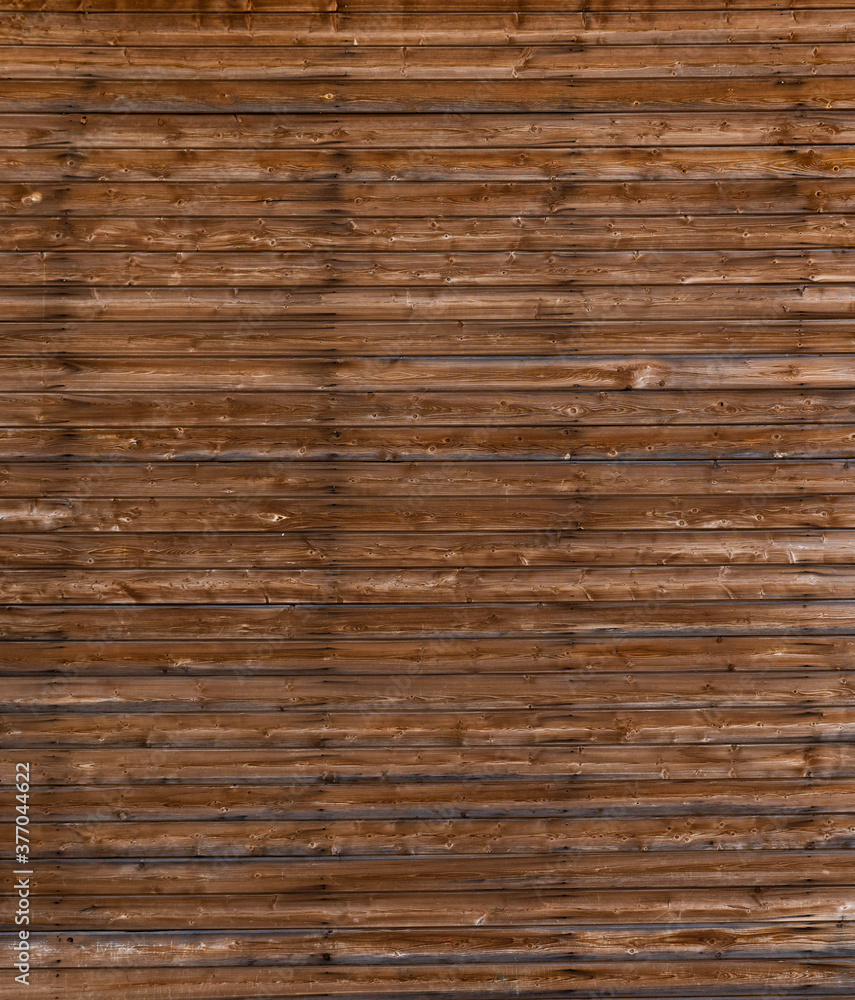 Big Texture new wood fence varnished.