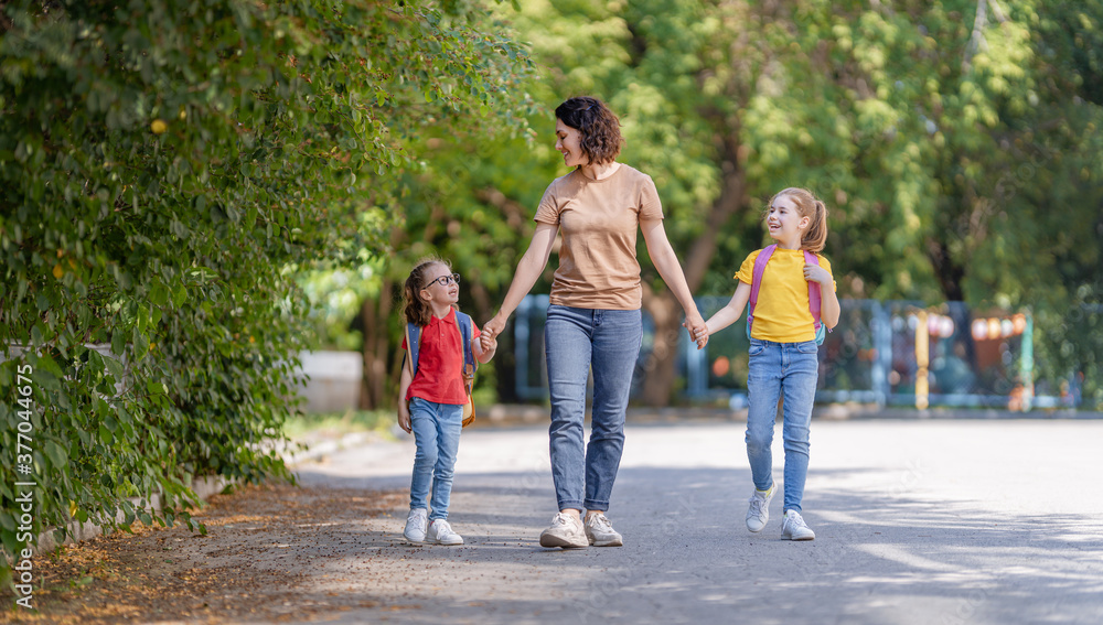 Parent and pupils go to school