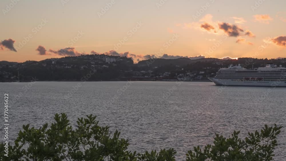 Time lapse of a ship in a sunset in Kristiansand, Norway Time lapse of a ship in a sunset in Kristiansand, Norway