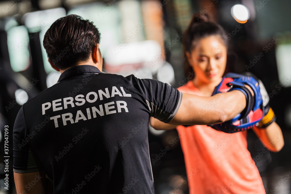 Fototapeta premium personal trainer is practicing boxing