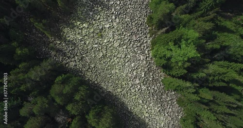 Stone river in South Ural /  place of difficult hiking, active lifestyle, explore and discover concept in rocky valley. Aerial drone wide shot at summer sunny day photo