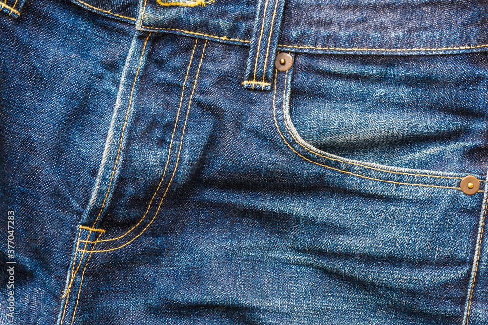 Close up indigo jean textile with fade from long time used Close up indigo jean textile with fade from long time used