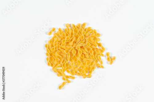 Pasta Farfalline top view on white background. Close up raw uncooked delicious pasta