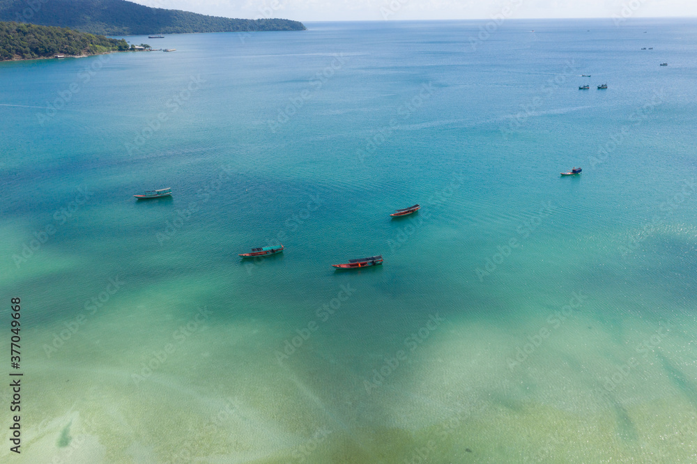 Long Beach on Koh Rong Samloem island in Cambodia, South-East Asia. top view, aerial view of a beautiful tropical island in Gulf of Thailand. With copy space texture for holiday design background.
