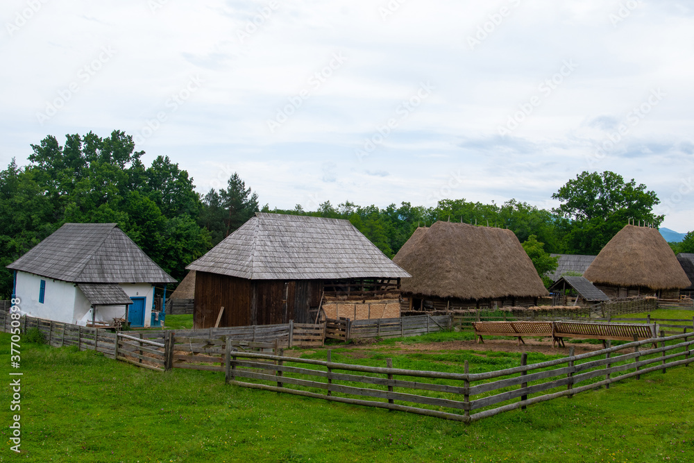peasant house in the traditional village with thatched roof and tile peasant house in the traditional village with thatched roof and tile
