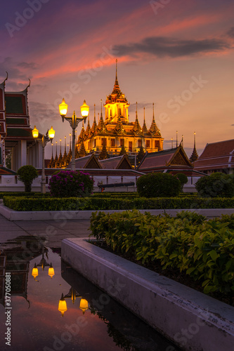 Wat Ratchanatdaram a Beautiful temple at twilight time, the temple is best known for the Loha Prasat famous landmark for tourist in Bangkok,Thailand photo