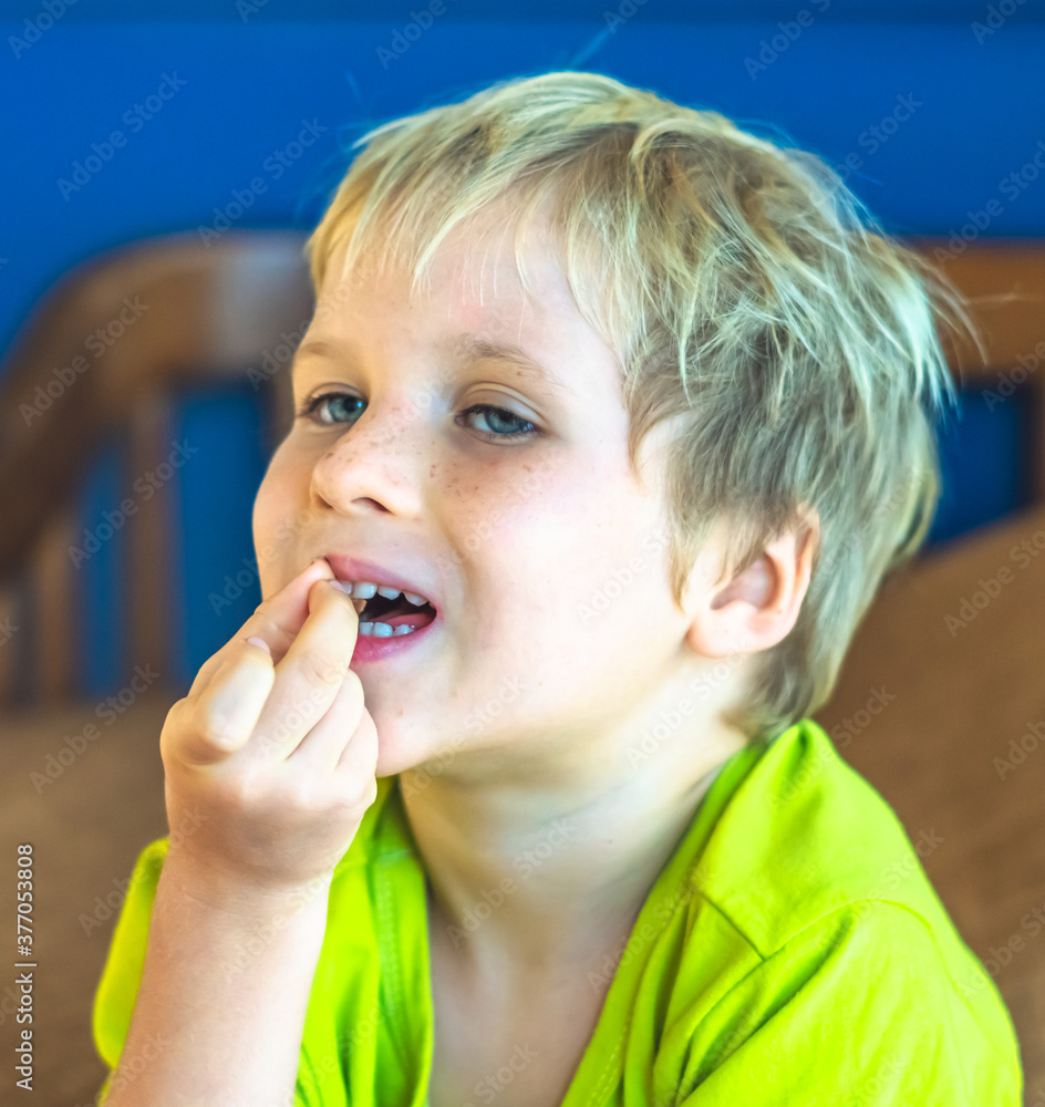Portrait mischievous cute blond blue eyed boy making freckles face play laughing in happy mood. Funny photo, happiness lifestyle. Daycare, simple joys happy childhood, behaviour education psychology Portrait mischievous cute blond blue eyed boy making freckles face play laughing in happy mood. Funny photo, happiness lifestyle. Daycare, simple joys happy childhood, behaviour education psychology