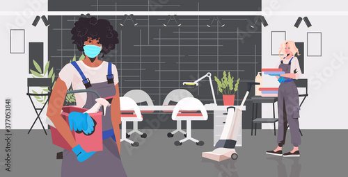 professional cleaners couple mix race janitors using cleaning equipment working together beauty salon interior full length horizontal vector illustration