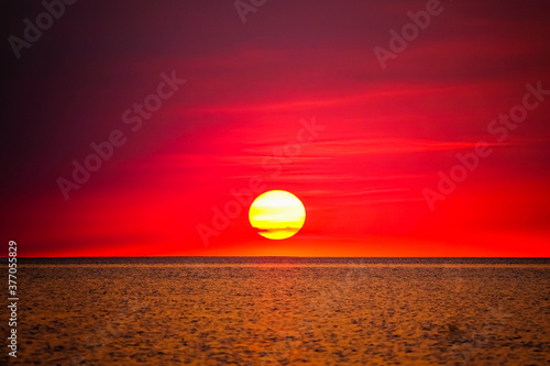 red sunrise or sunset over the sea © Matthias
