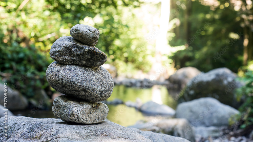 Closeup of stone balance in border river Closeup of stone balance in border river