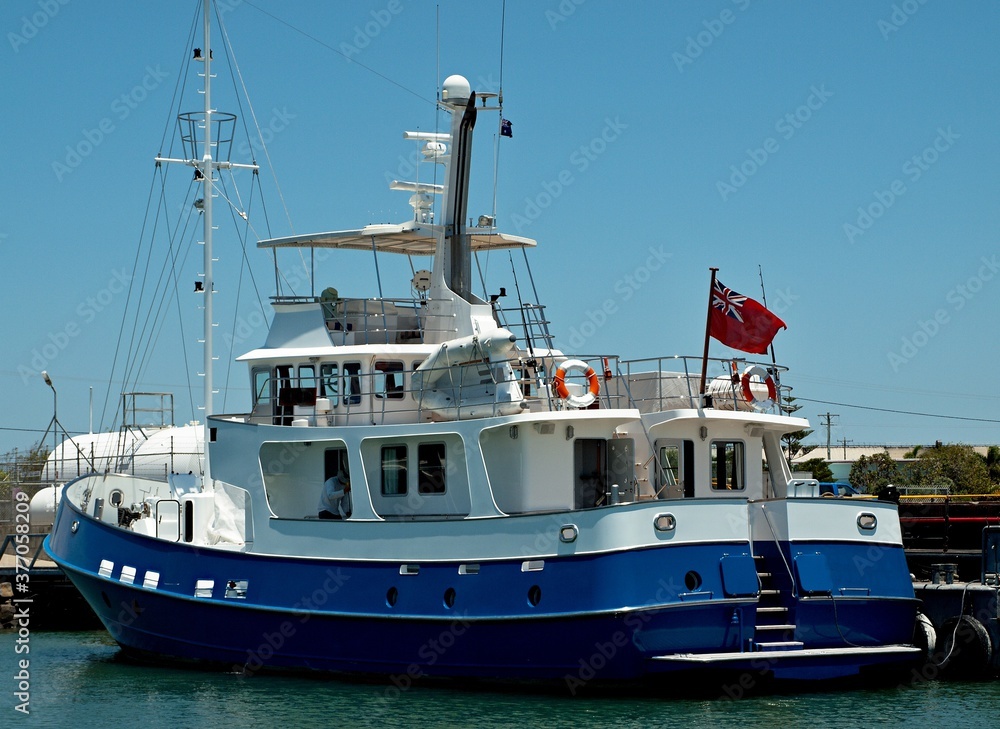  Luxury motor yacht docked at Tin Can Bay, Queensland, Australia.
