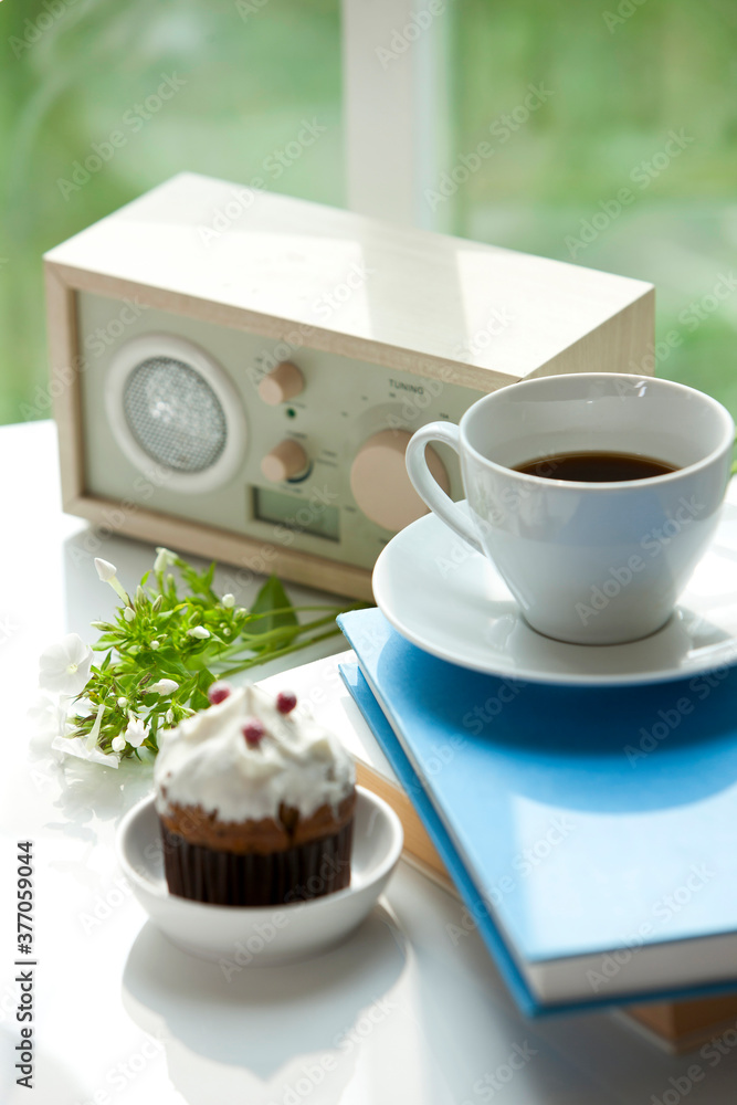 coffee on book with muffin coffee on book with muffin