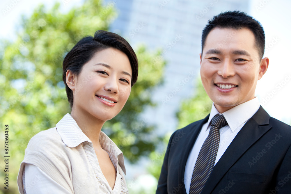 Portrait of smiling businessman and businesswoman Portrait of smiling businessman and businesswoman