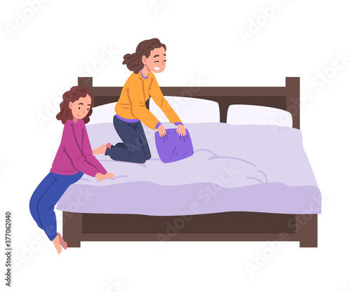 Slumber Party, Cute Girls in Pajamas Playing Pillow Fight on Bed Cartoon Style Vector Illustration