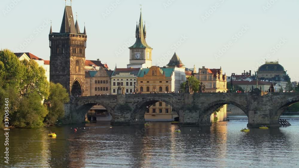 stone Charles Bridge in the center of Prague on the Vltava river and the roofs of old buildings in the town at sunset
stone Charles Bridge in the center of Prague on the Vltava river and the roofs of old buildings in the town at sunset