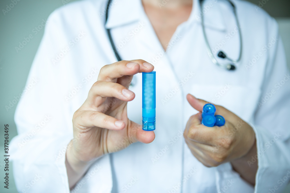 Healthcare - medication. Doctor with homeopathic pills. Healthcare - medication. Doctor with homeopathic pills.