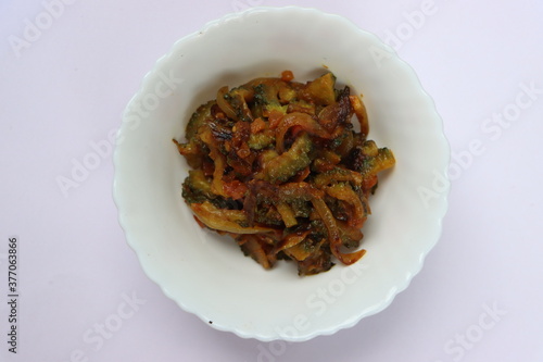 Bitter gourd fry, traditional curry in South India photo