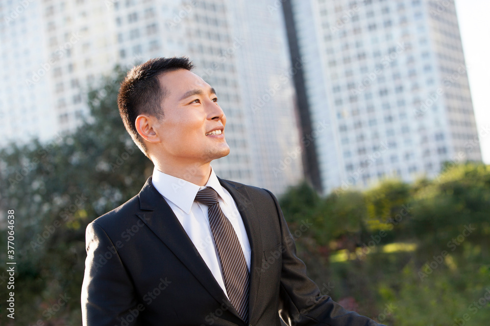Happy businessman looking at view Happy businessman looking at view
