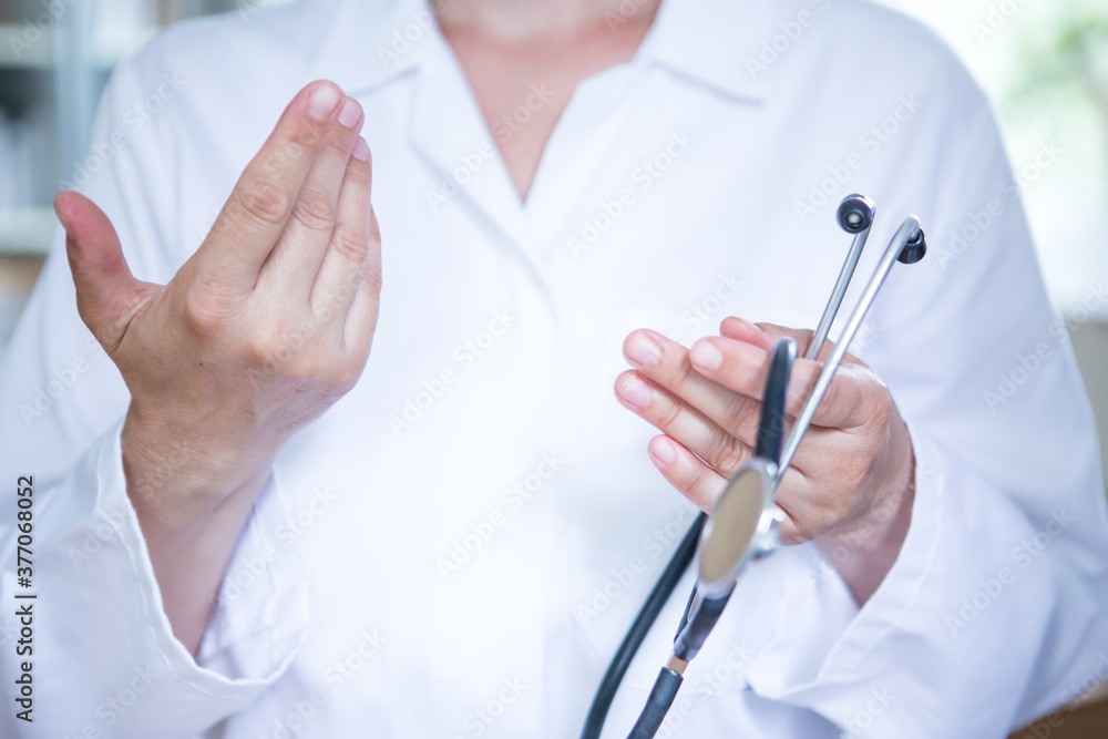 Healthcare - doctor in the hospital talking to a patient. Healthcare - doctor in the hospital talking to a patient.