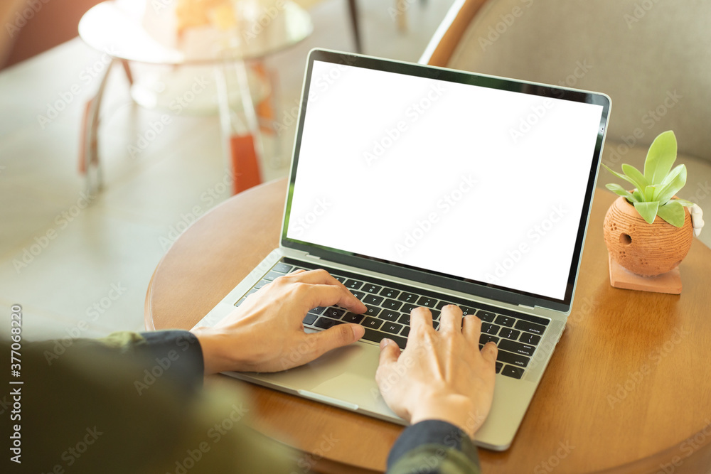computer mockup blank screen.hand woman work using laptop with white background for advertising,contact business search information on desk at coffee shop.marketing and creative design computer mockup blank screen.hand woman work using laptop with white background for advertising,contact business search information on desk at coffee shop.marketing and creative design