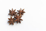 star anise on a white background. this aromatic spice is used for cooking food and various drinks