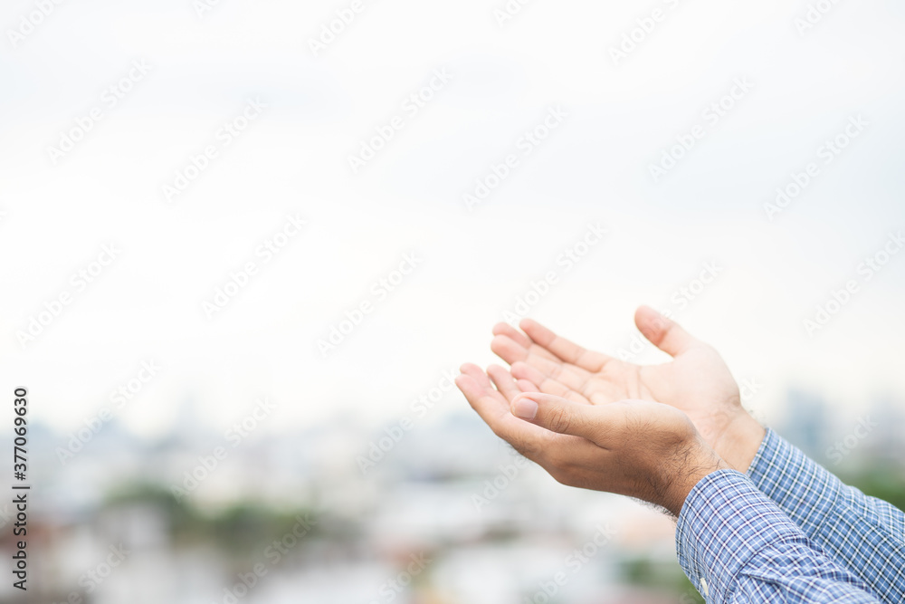 Praying hands for hope stretch into the sky. Religion and belief concept. Praying hands for hope stretch into the sky. Religion and belief concept.