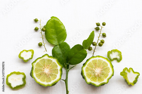 herbal vegetation kaffir lime and leaves local flora of asia arrangement flat lay postcard style on background white wooden