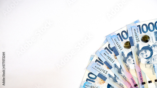 Canvas Print Philippine Peso 1000 bills on white background