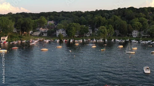 Beautiful cottage country aerial view of boats anchored and docked on the cottage lake front shore line at lake Geneva, Wisconsin.