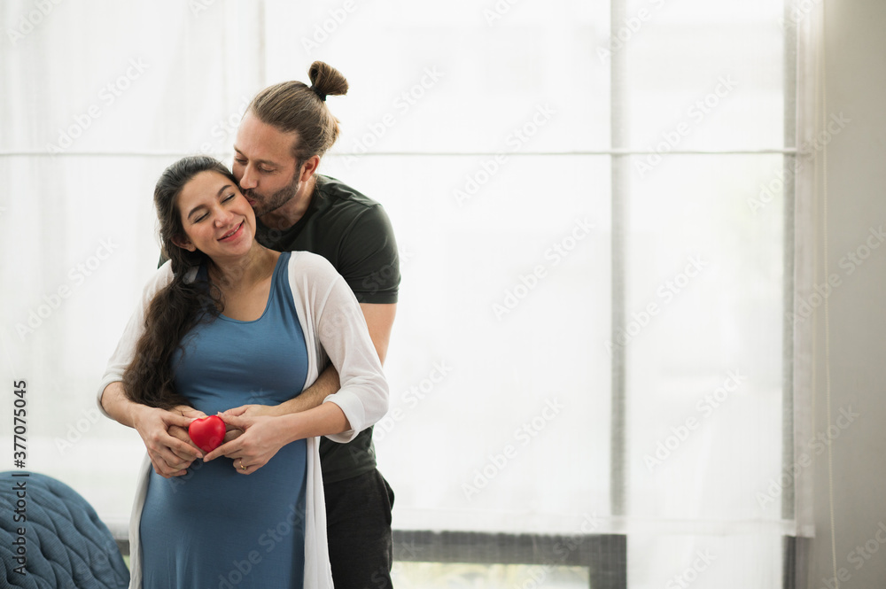Handsome beard man take care his pregnant wife. Happy family concept. Handsome beard man take care his pregnant wife. Happy family concept.