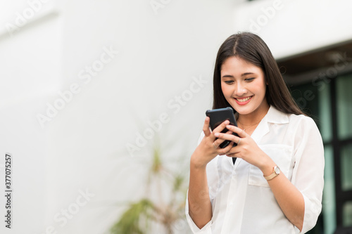 Young asian beautiful women using smartphone .
