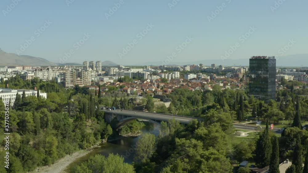Podgorica, Montenegro - August, 2020: aerial view of Podgorica capital city of Montenegro. Drone shot on a panorama of the city where you can see the river bridges and the old city. Podgorica, Montenegro - August, 2020: aerial view of Podgorica capital city of Montenegro. Drone shot on a panorama of the city where you can see the river bridges and the old city.
