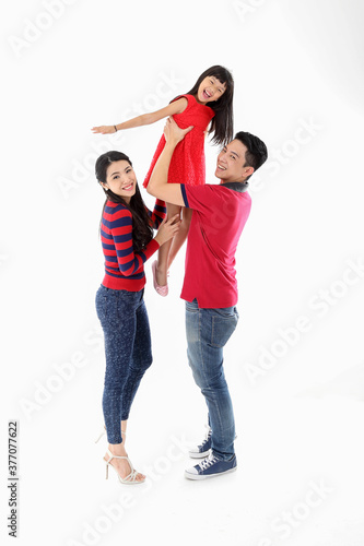Southeast Asian family parents daughter father mother child pose happy ply carry on white background