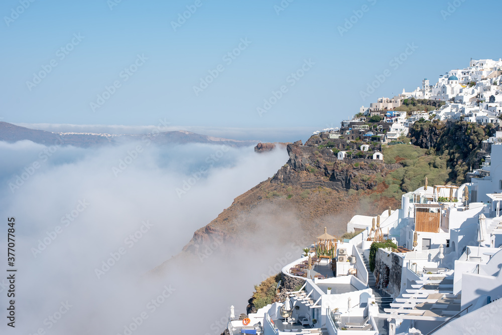 Obraz premium Anedosa sea fog covering the Santorini caldera. 
