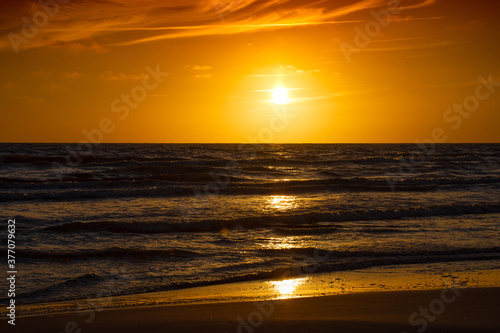 Amazing sunset over the beach on Baltic sea © vbaleha