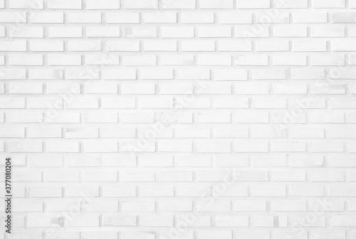 White brick wall texture background in room at subway. Brickwork stonework interior, rock old concrete grid uneven abstract weathered grey clean tile design, horizontal architecture wallpaper.