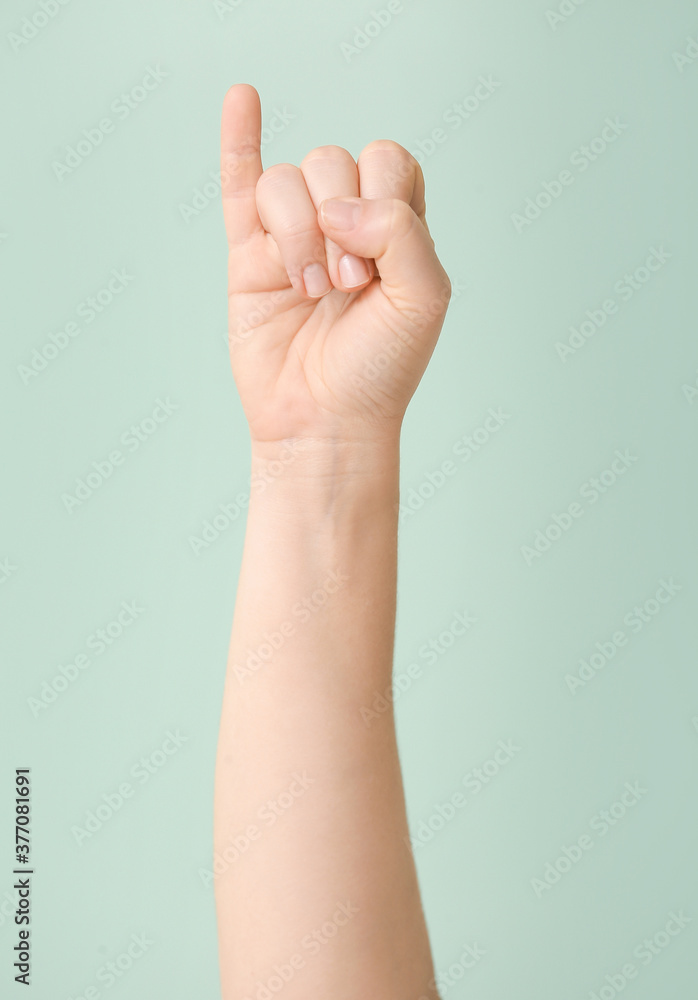 Hand showing letter I on color background. Sign language alphabet Hand showing letter I on color background. Sign language alphabet