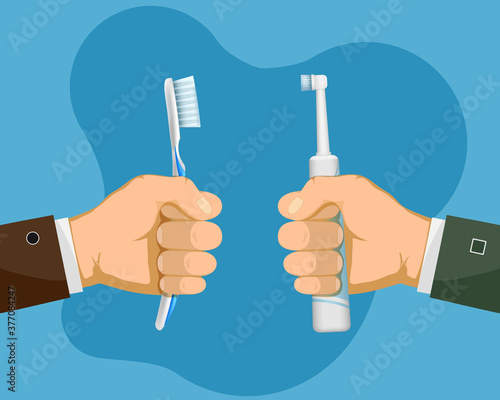 Human hands are holding manual and electric toothbrushes
