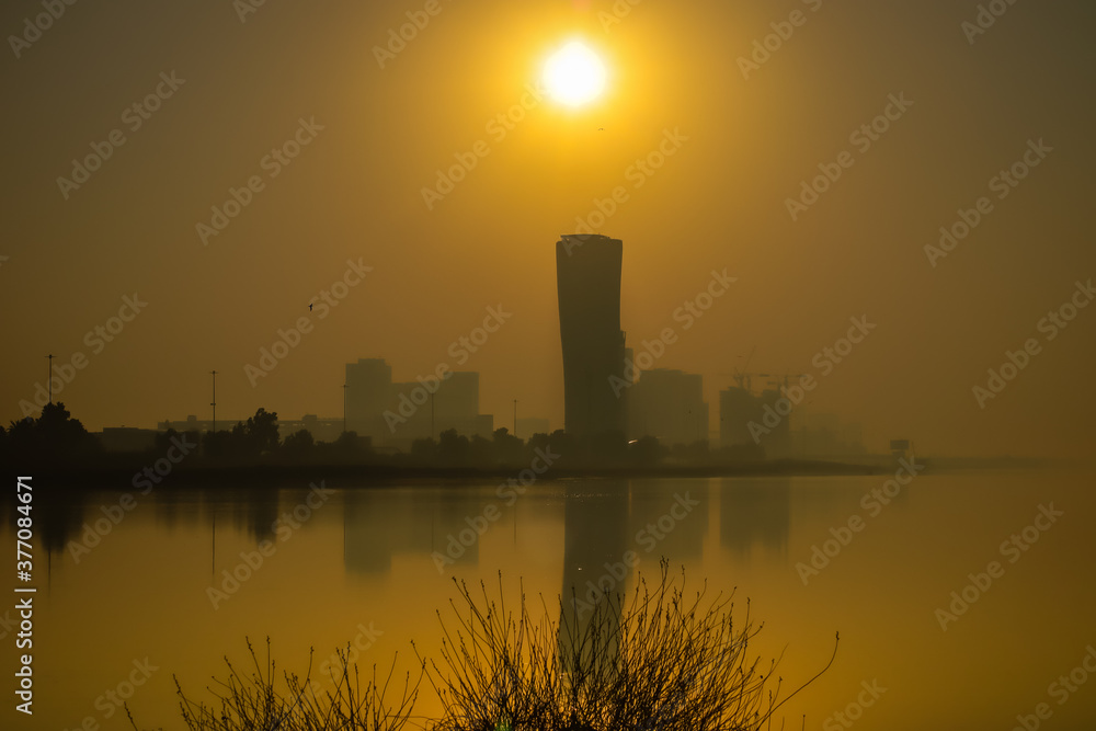 Sunrise Sky view background behind capital gate tower of Abu Dhabi, Skyscrapers in Capital city of United Arab Emirates