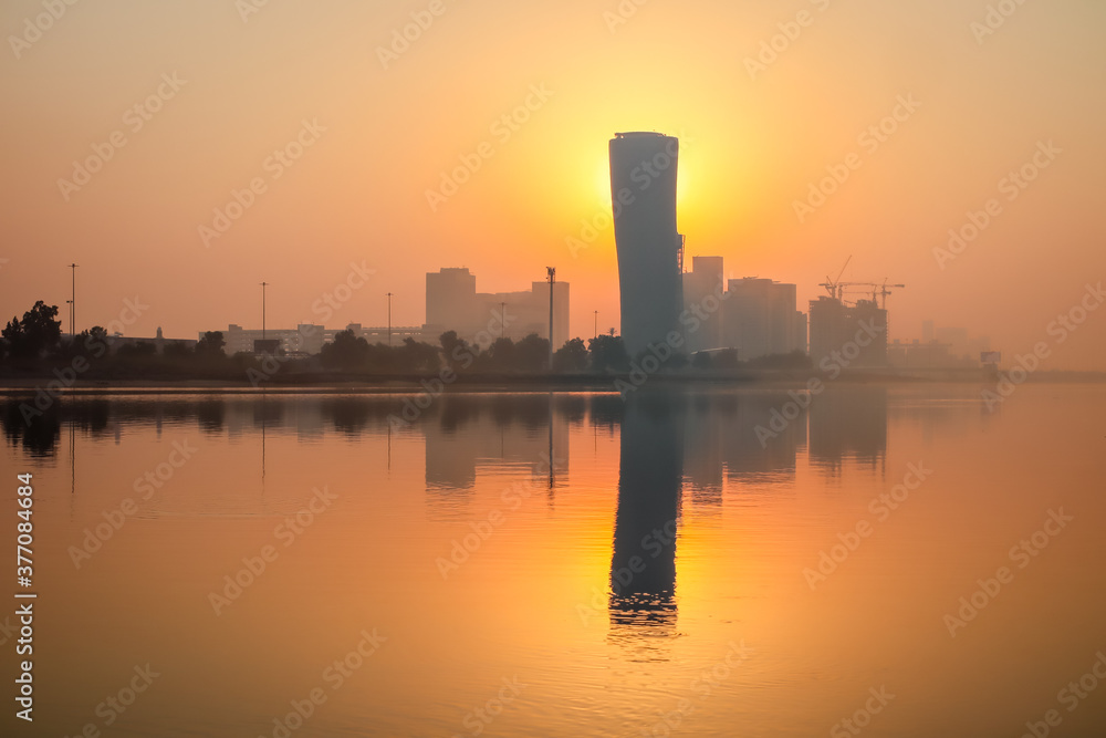 Sunrise Sky view background behind capital gate tower of Abu Dhabi, Skyscrapers in Capital city of United Arab Emirates
