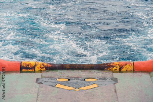 Stern roller of an anchor handling tug boat while sailing at oil field photo