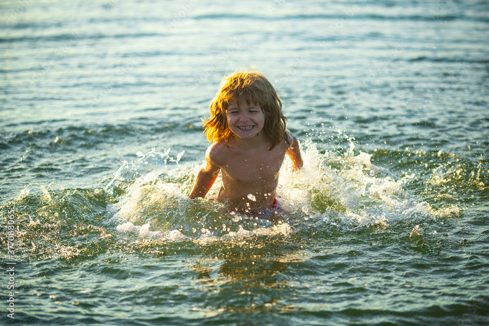 Happy kid on vacations at seaside running in the water. Happy kid on vacations at seaside running in the water.